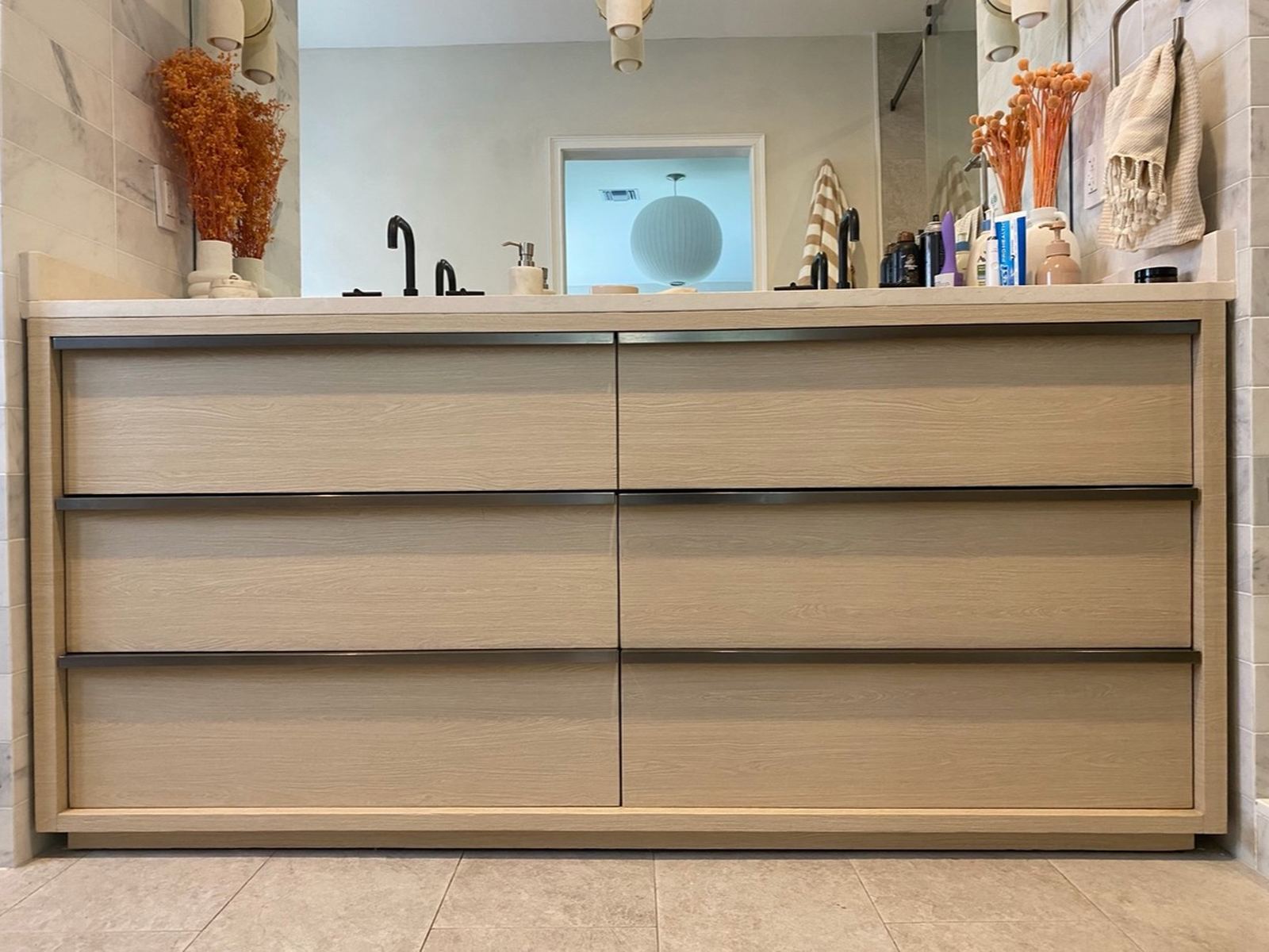 The same vanity after resurfacing, light white oak drawer fronts and frame