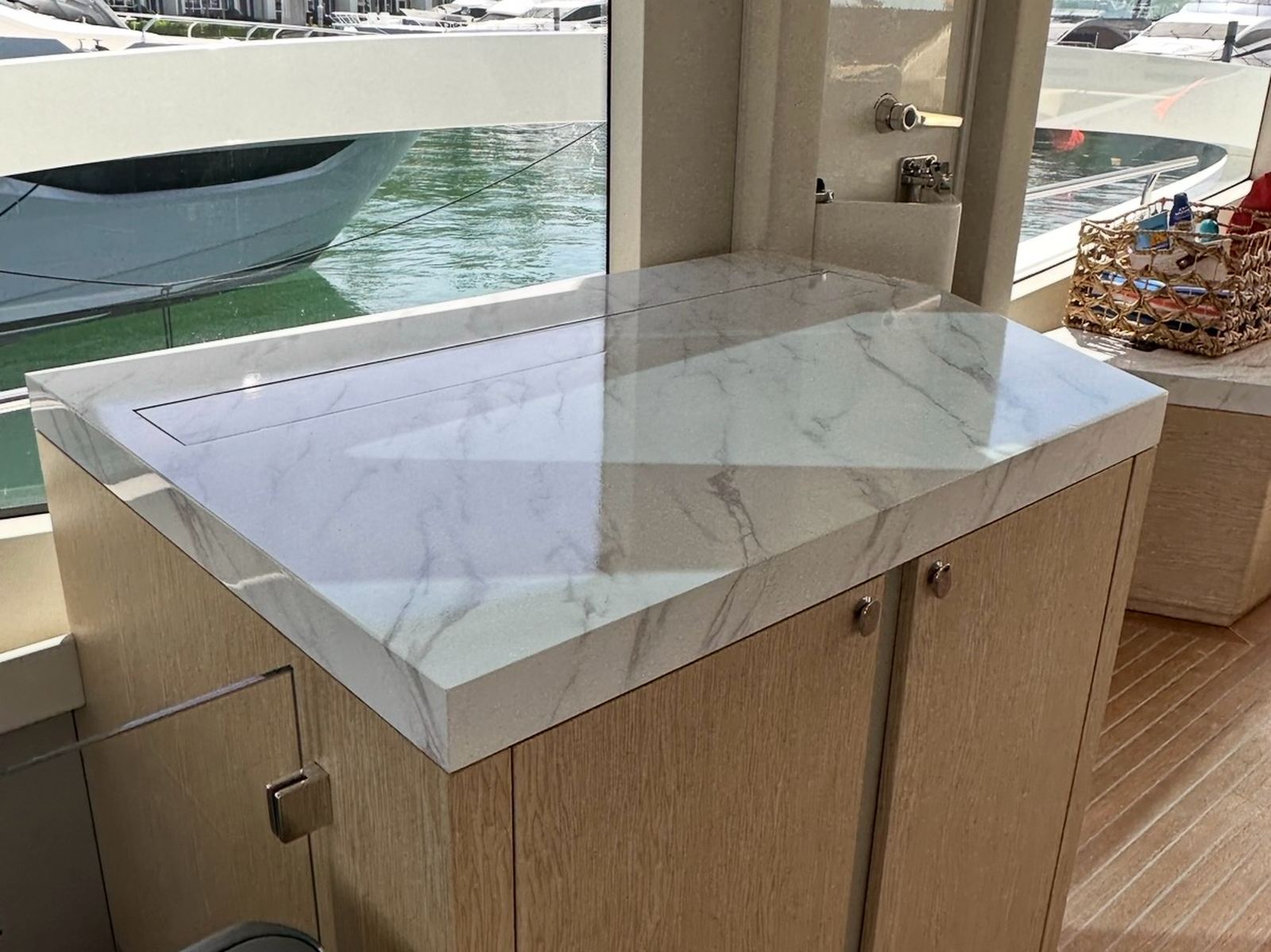 The same galley countertop after resurfacing, white marble finish